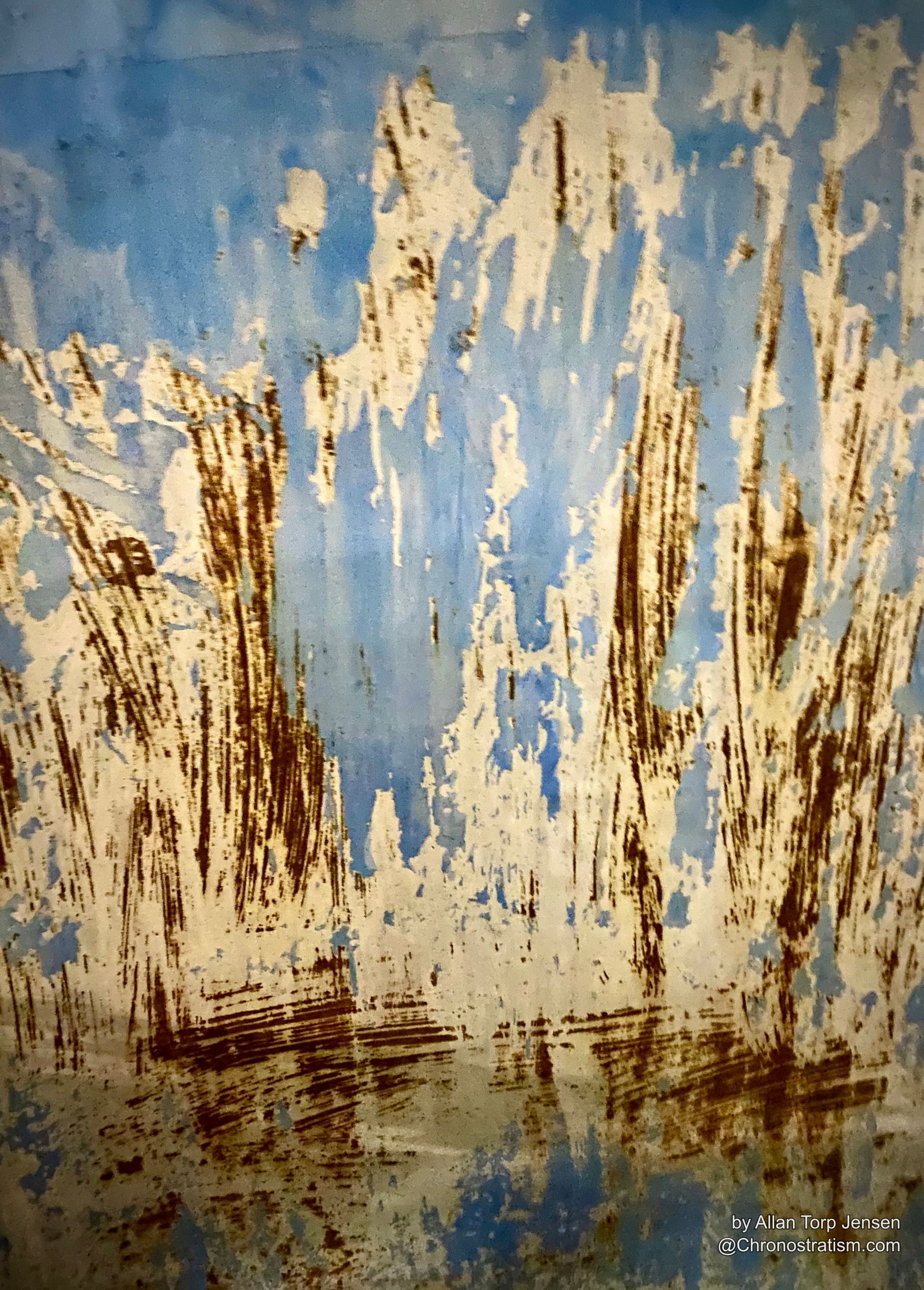 Vertical rust stains bleeding down through peeling white paint over a blue-painted hull.